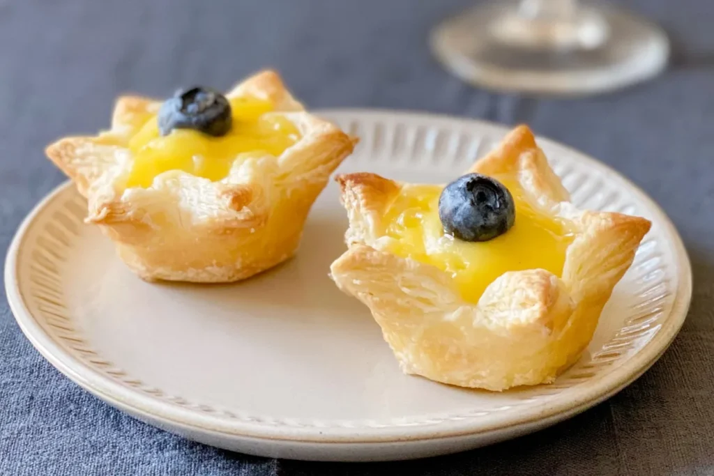 Lemon Curd Puff Pastry Cups on a Serving Plate