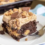 Reese’s Peanut Butter Cup Poke Cake: A Dessert Dream Come True 5 Reese’s Peanut Butter Cup Poke Cake Slice on a Plate