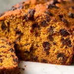 Chocolate Chip Pumpkin Bread: The Ultimate Fall Treat 5 Chocolate Chip Pumpkin Bread Slice on a Wooden Table