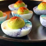 Halloween Deviled Eggs Recipe That’s SUPER Spooky! Delish Bite 5 Spooky Halloween Deviled Eggs on a Platter